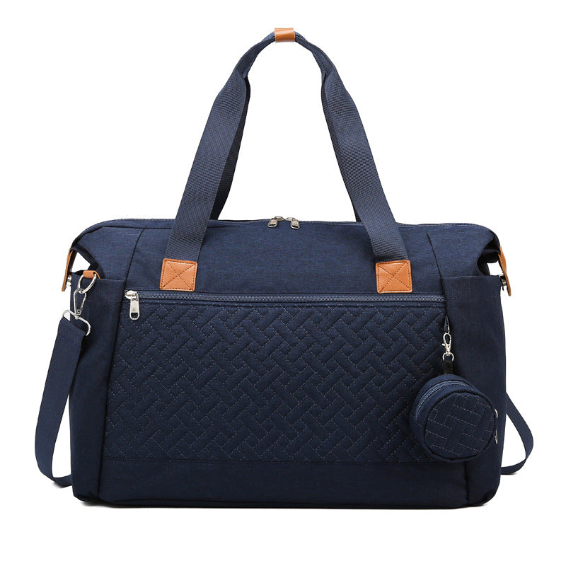 Große marineblaue Wickeltasche mit Steppmuster, Rundtasche und Schultergurt