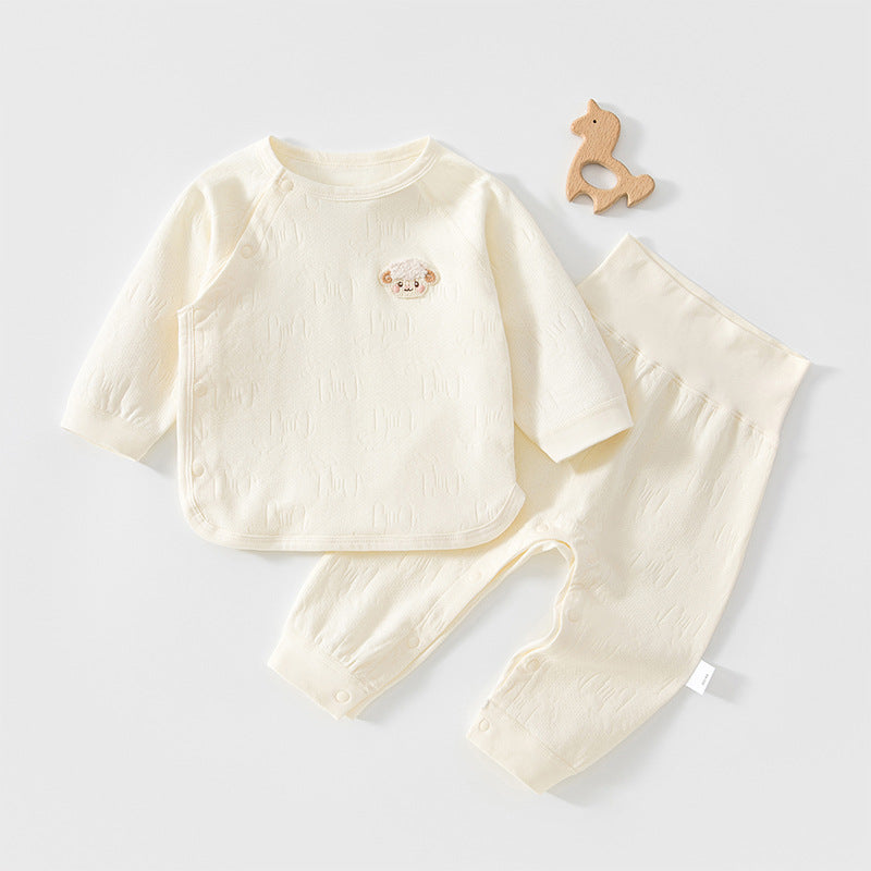 Cremefarbenes Baby-Set mit Wickeljacke und hoher Hose