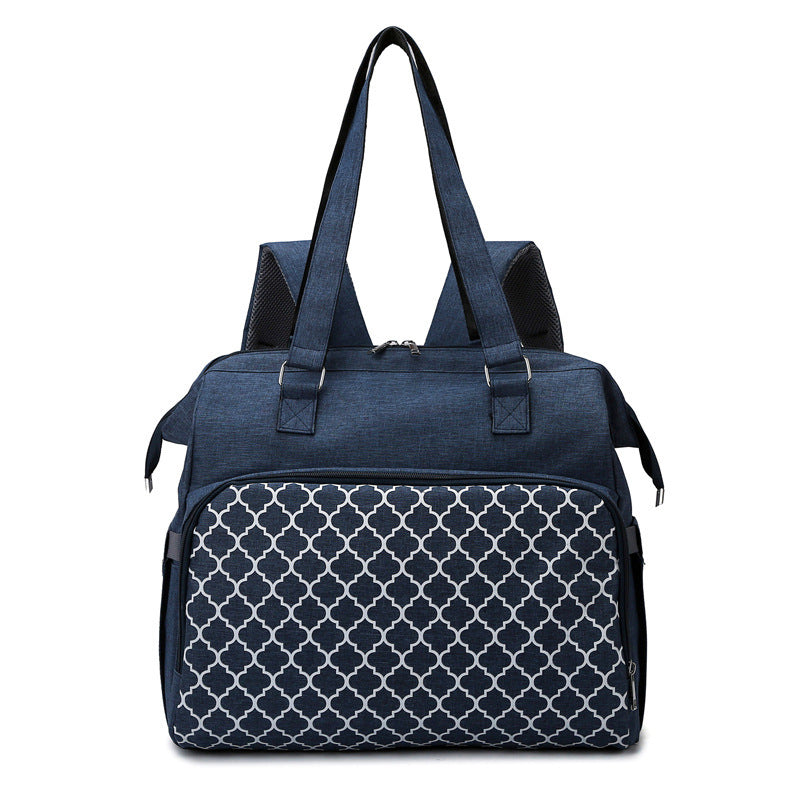 Marineblaue Wickeltasche mit Gittermuster, Henkeln und Rucksackgurten