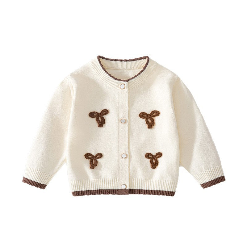 Cremefarbene Baby-Strickjacke mit braunen Schleifen und braunem Rand
