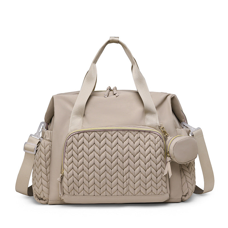 Beigefarbene Wickeltasche mit gestepptem Muster, Rundtasche und Schultergurt