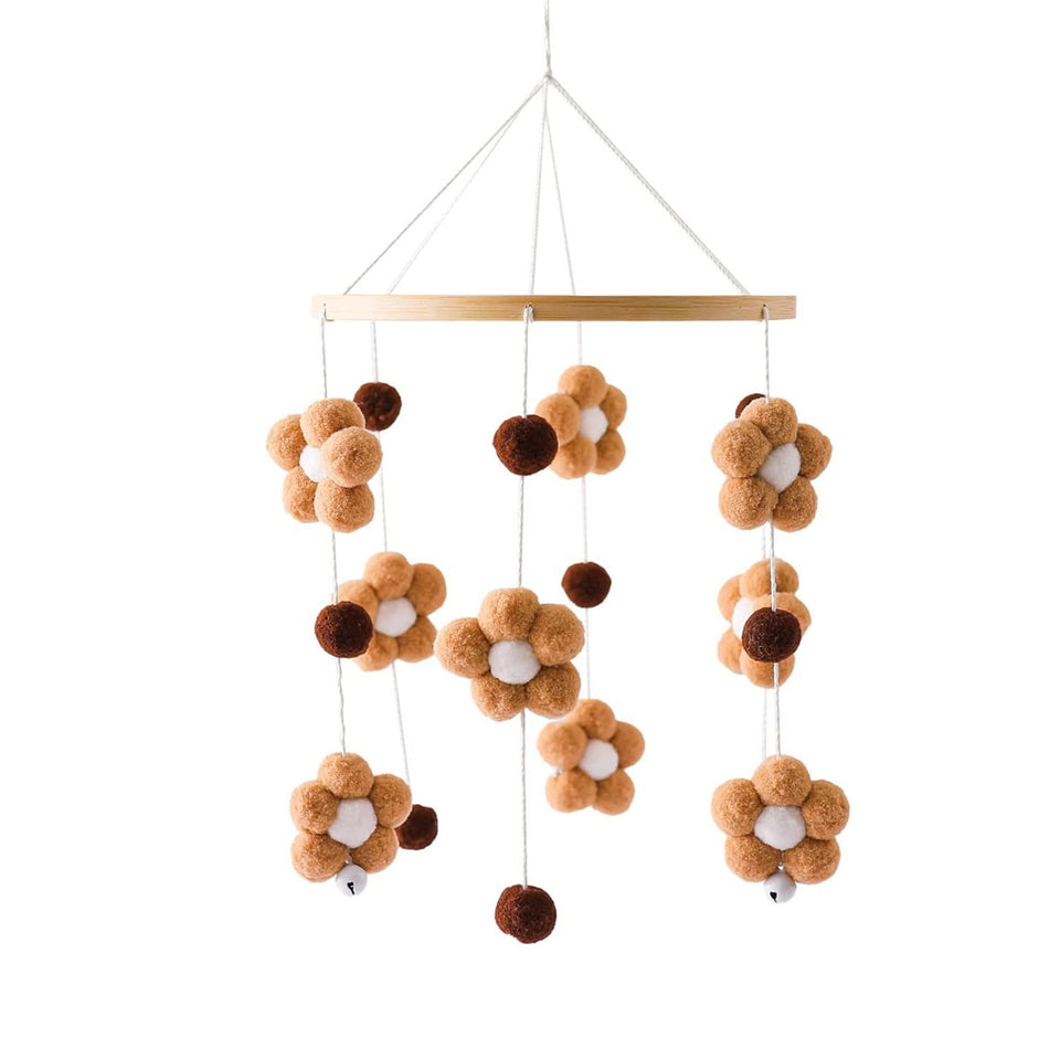 Mobile mit braunen und weißen Pompon-Blumen am Holzring