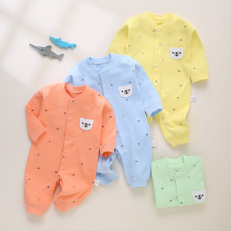 Vier Baby-Strampler mit Bären-Patch in Orange, Hellblau, Gelb und Mint