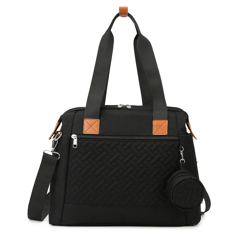 Kleine schwarze Wickeltasche mit Steppmuster, Rundtasche und Schultergurt