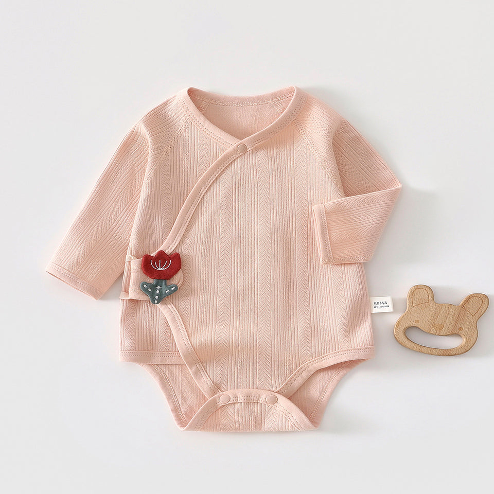 Rosa Wickelbody mit Tulpen-Applikation
