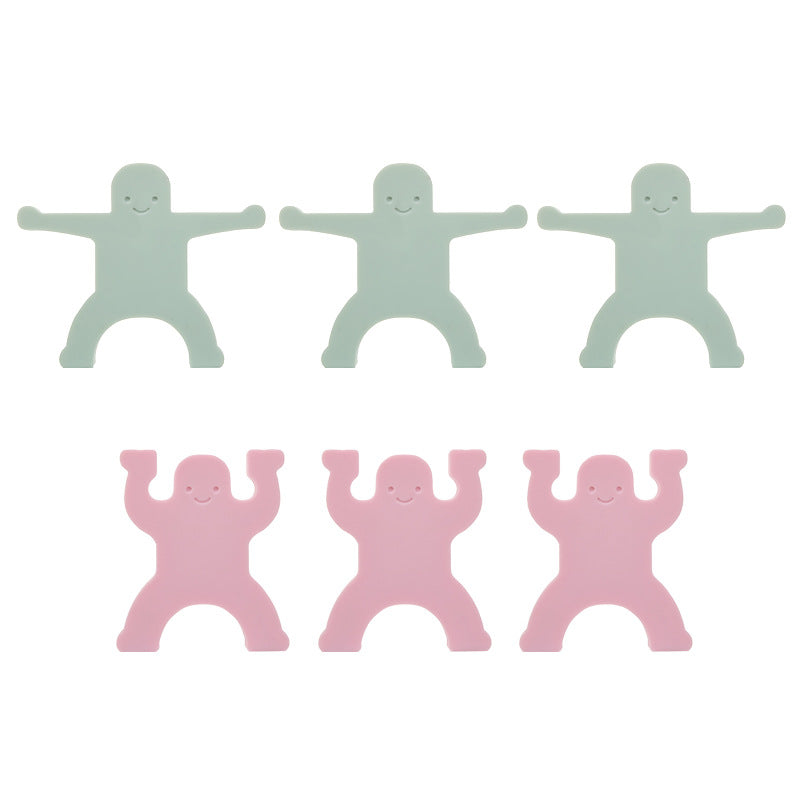 Sechs Stapelfiguren aus Silikon, drei in Mint mit ausgestreckten Armen und drei in Rosa mit erhobenen Armen
