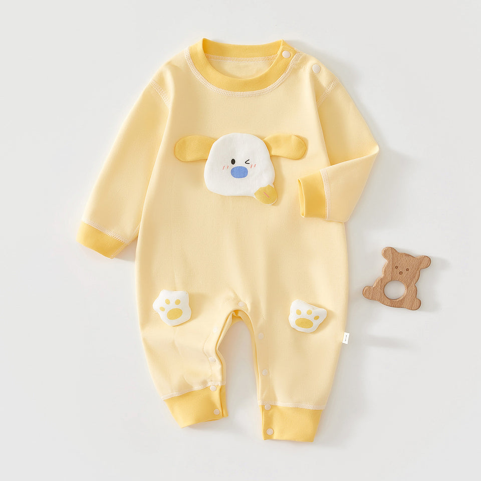 Gelber Baby-Strampler mit Hundeapplikation