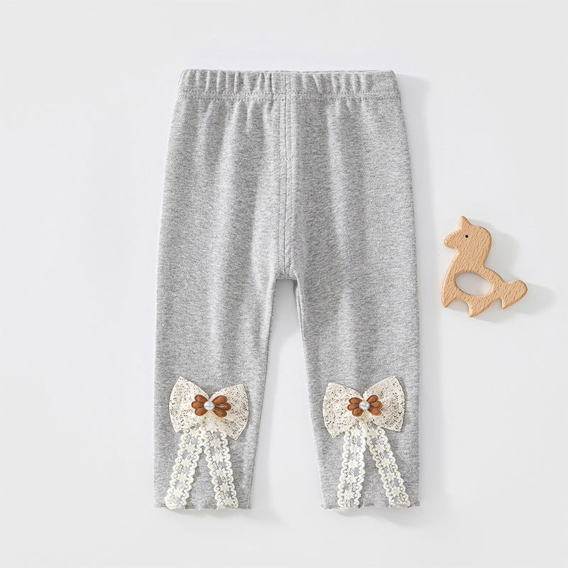 Graue Leggings mit Spitzenschleife und Knopf am Bein