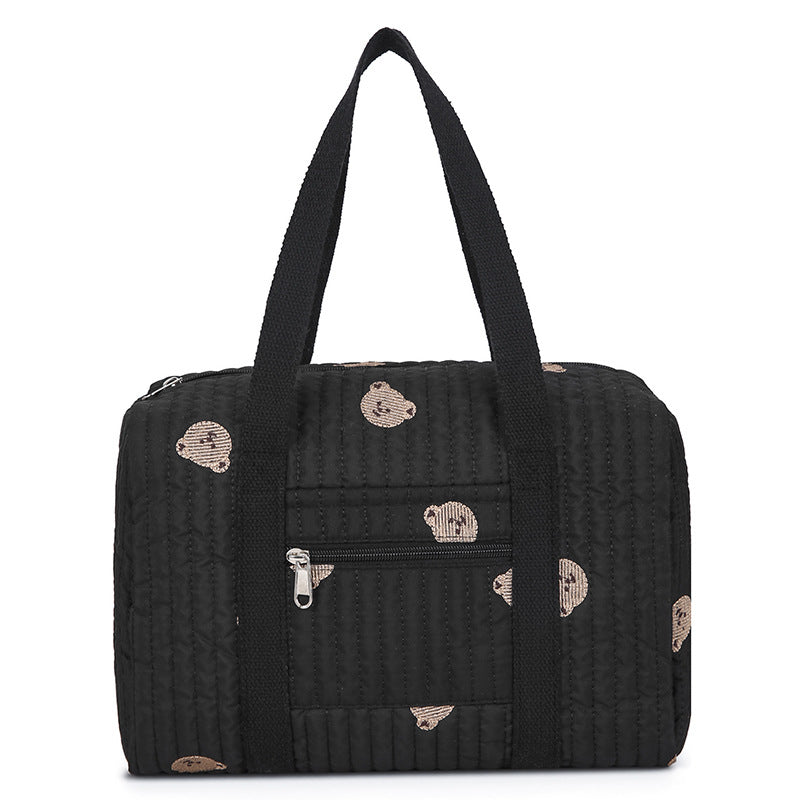 Schwarze gesteppte Tasche mit gestickten Bärenköpfen