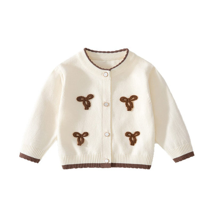 Cremefarbene Baby-Strickjacke mit braunen Schleifen und braunem Rand