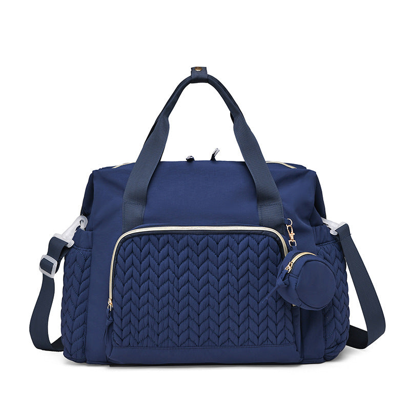 Marineblaue Wickeltasche mit gestepptem Muster und Rundtasche