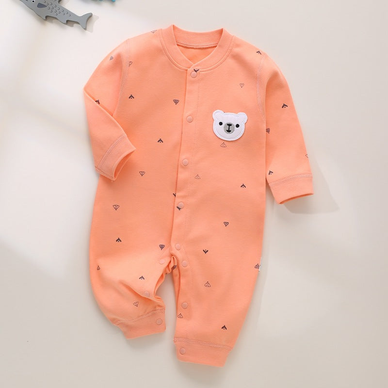 Orangefarbener Baby-Strampler mit Bären-Patch