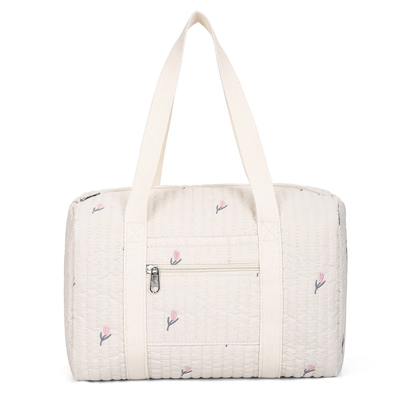 Cremefarbene gesteppte Tasche mit gestickten rosa Tulpen