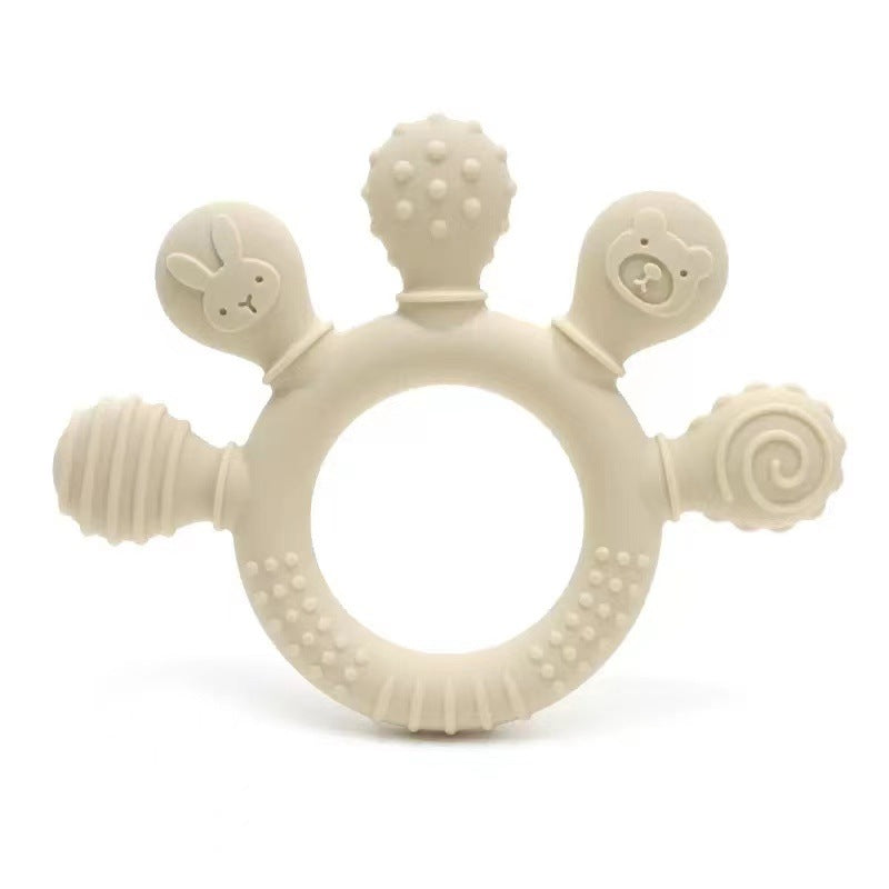 Beißring Sonne aus Silikon in Creme mit fünf Greifern